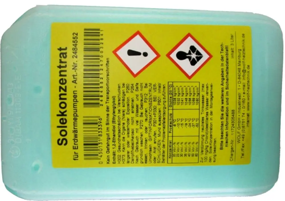 Produktbehälter mit gelber Etikette und Sicherheitswarnungen, zeigt Informationen zu einem Solekonzentrat auf Monoethylenglykol-Basis von der Marke Wolf.